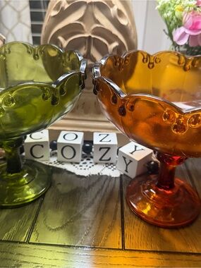 Pair of vintage Indiana Glass pedestal compote bowls featuring a scalloped rim